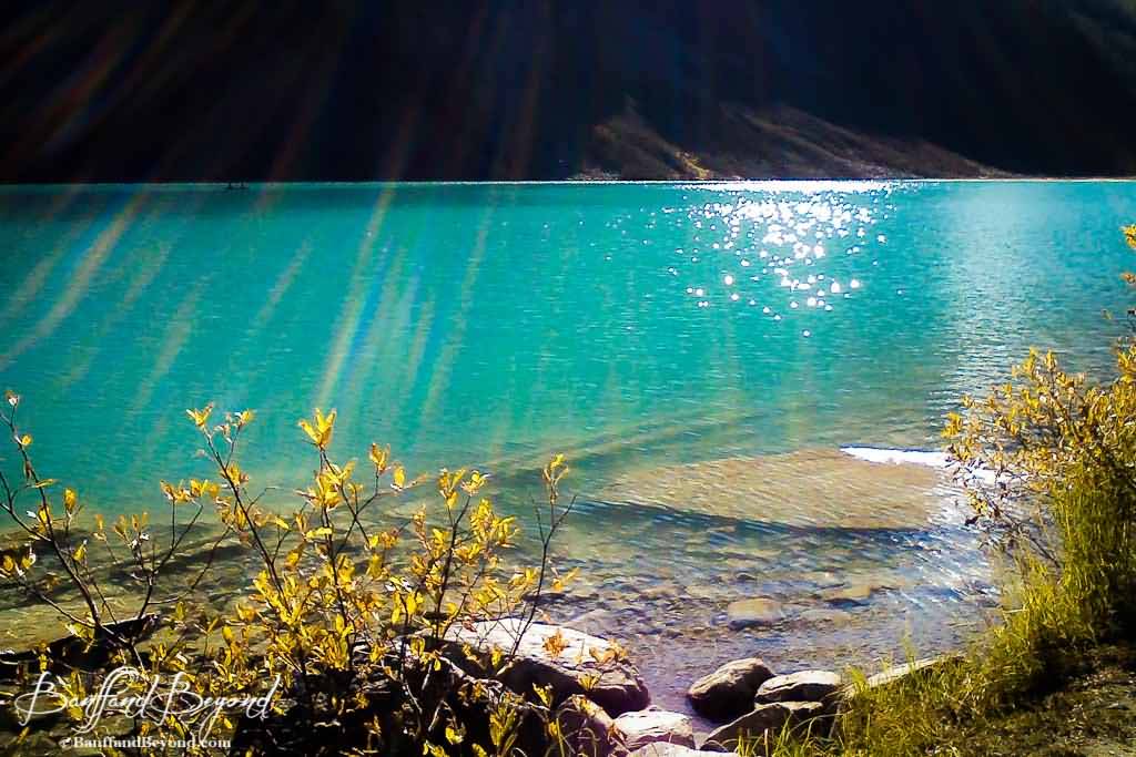 Rays Of Sunshine Reflecting In Lake Louise Water