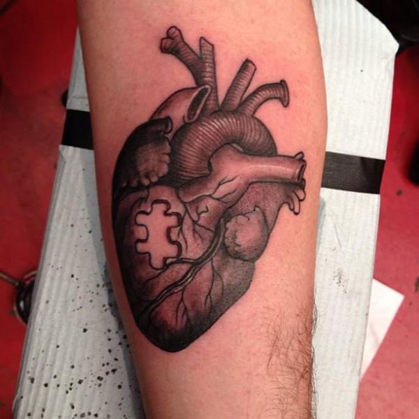 Real Heart Puzzle Tattoo On Arm By Camila Rocha