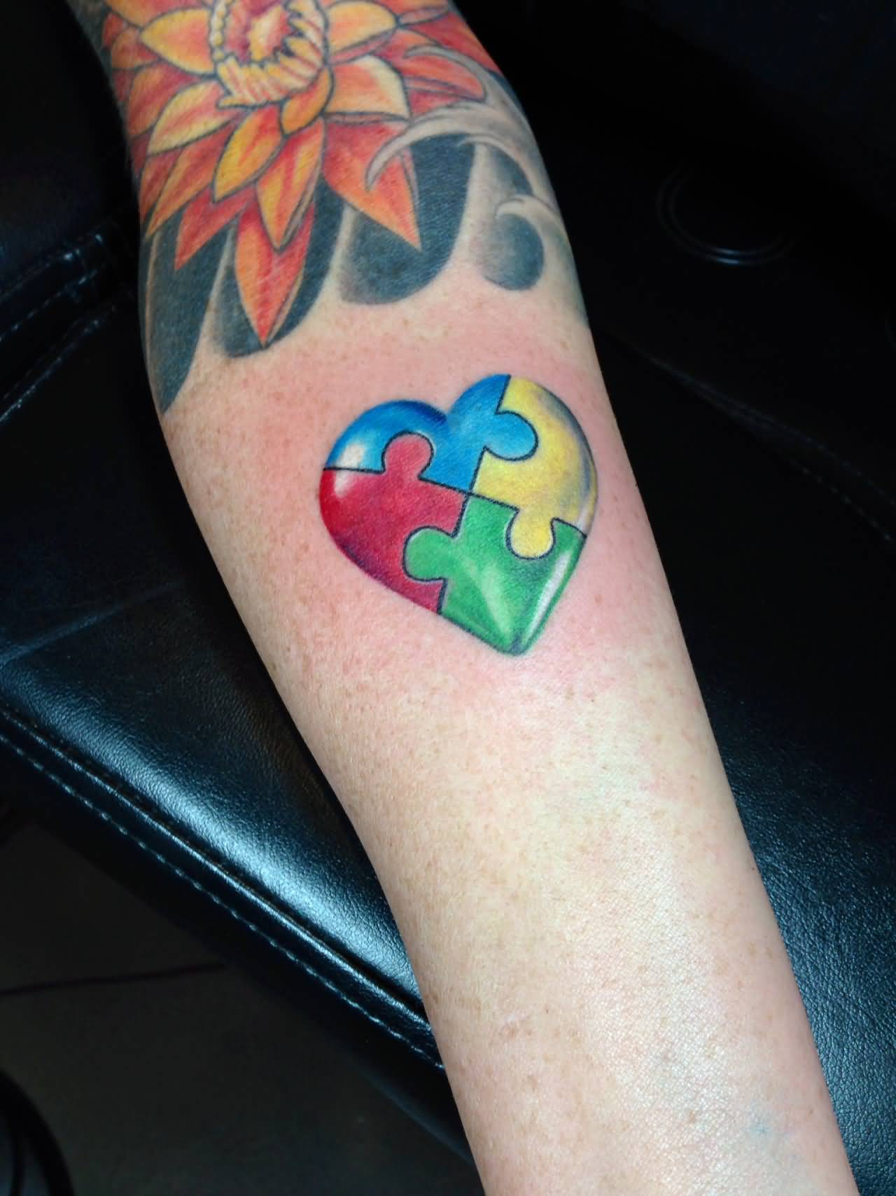 Realistic Autism Puzzle Heart Tattoo On Forearm By Monte Livingston