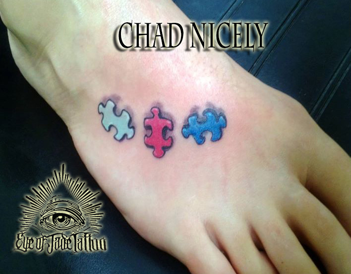 Realistic Autism Puzzle Pieces Tattoo On Foot