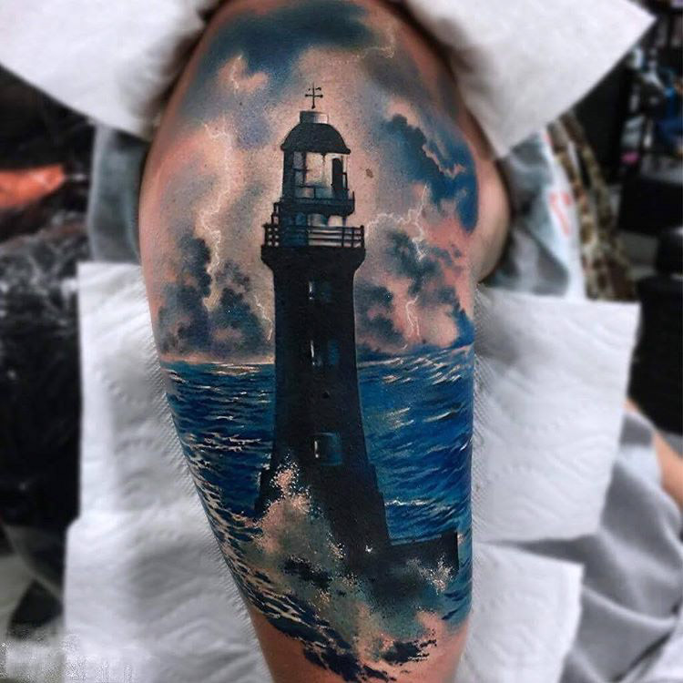 Realistic Blue Water And Lighthouse Tattoo On Sleeve