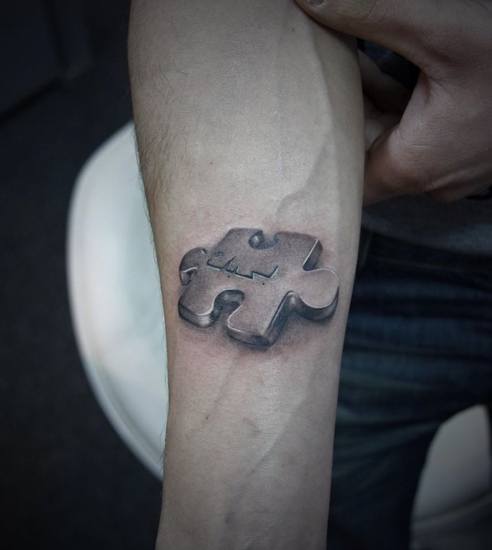 Realistic Grey Puzzle Tattoo On Arm