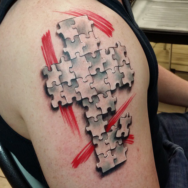 Realistic Puzzle Pieces Cross Tattoo On Shoulder