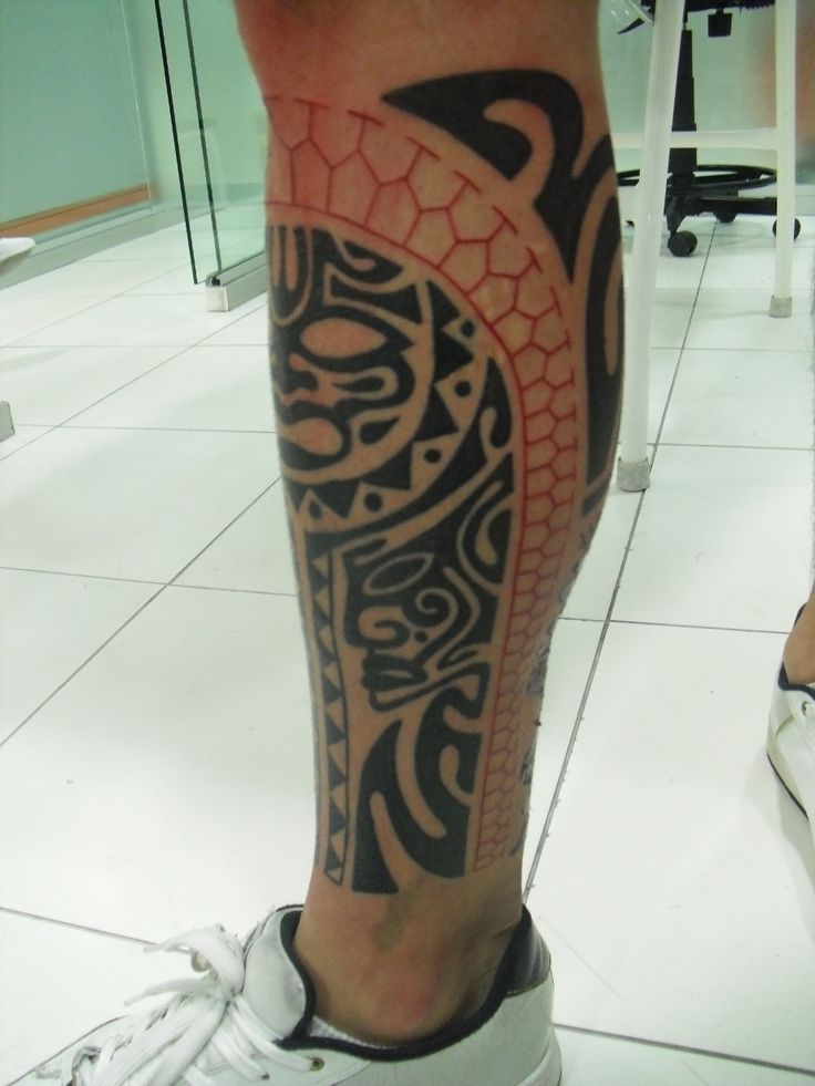 Red And Black Maori Tattoo On Leg