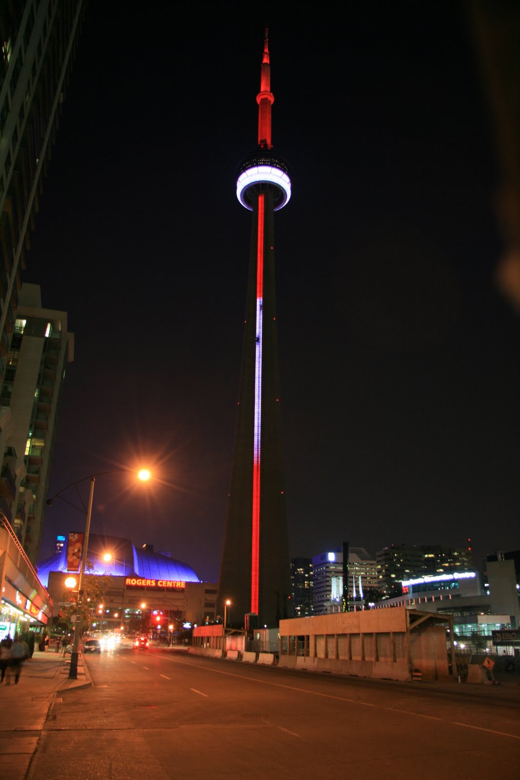 Red And White Lights On CN Tower During Night