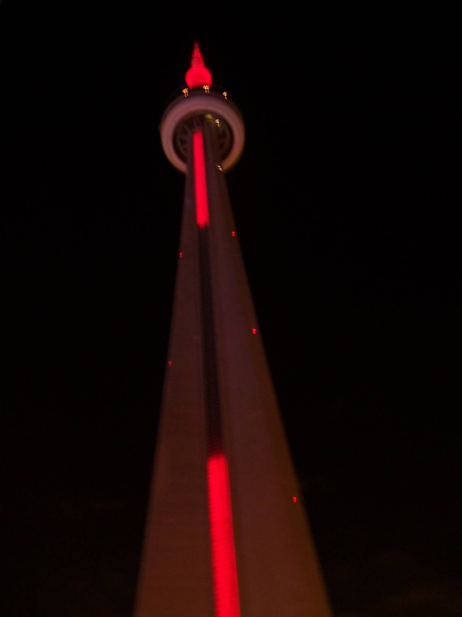 Red Lights On CN Tower During Night