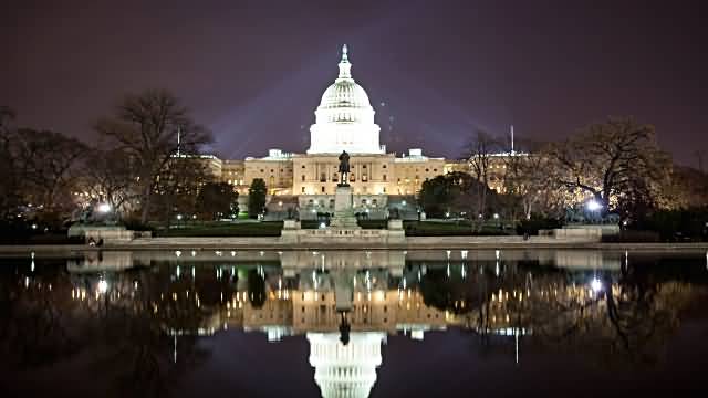 Reflection Of United States Capitol At Night