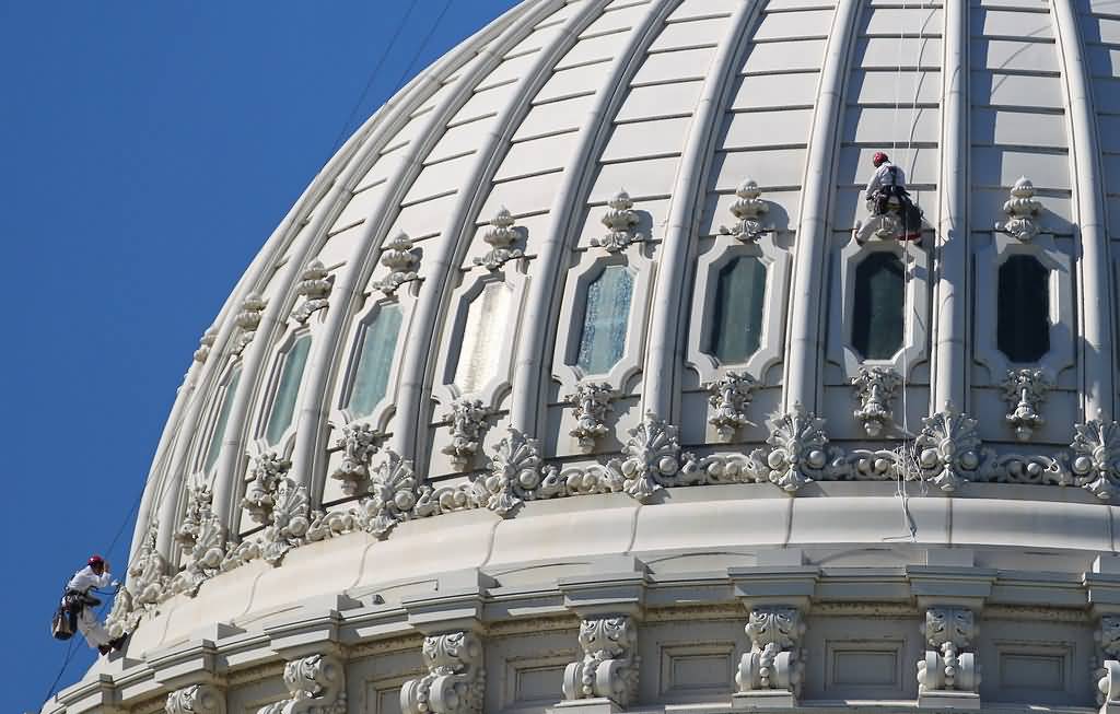 Restorer Workers Working On The Dome Of The United States Capitol