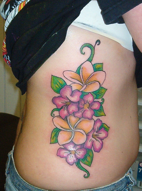 Rib Cage Colorful Flowers Tattoo