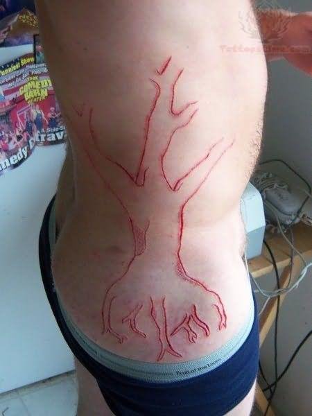Rib Cage Tree Scarification Tattoo
