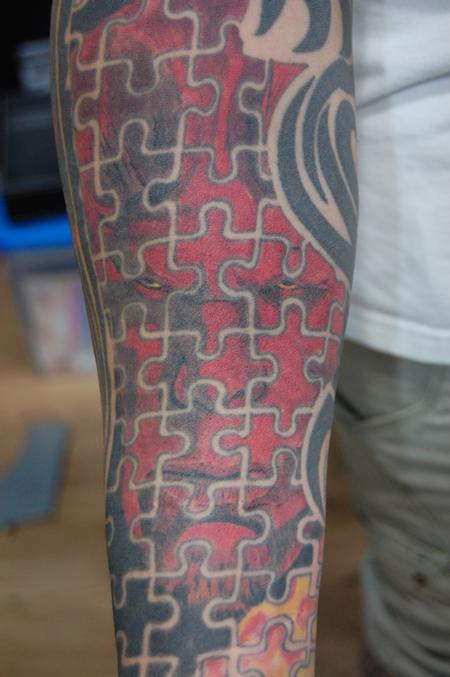 Ricos Hellboy Puzzle Tattoo On Sleeve