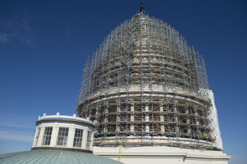 Scaffolding Covers The Dome Of The United States Capitol During A Restoration Project