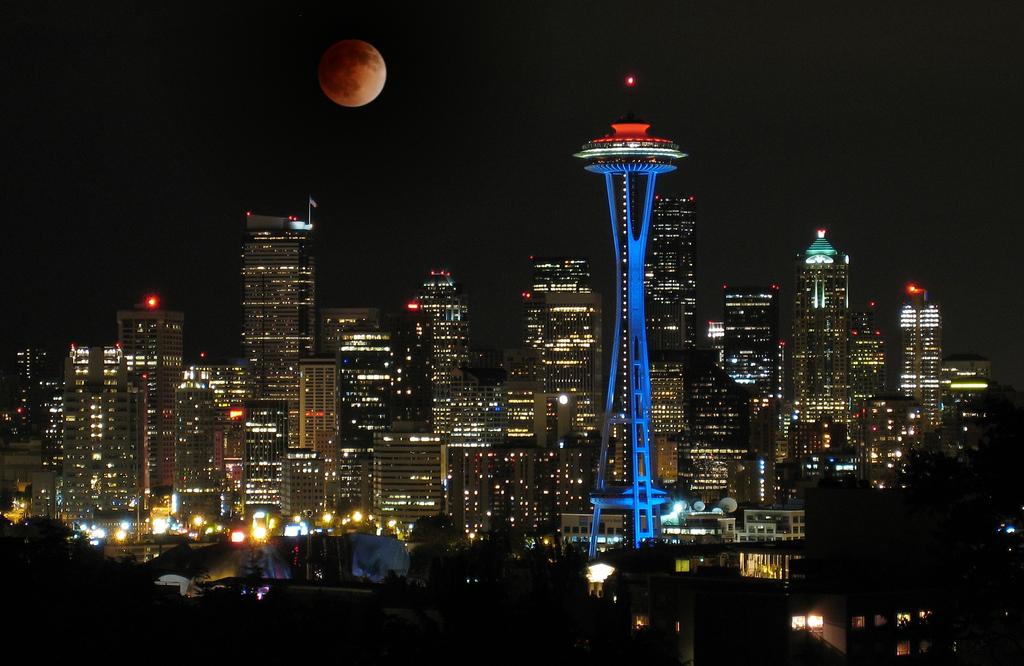 Seattle Skyline And Space Needle Tower With Full Moon At Night