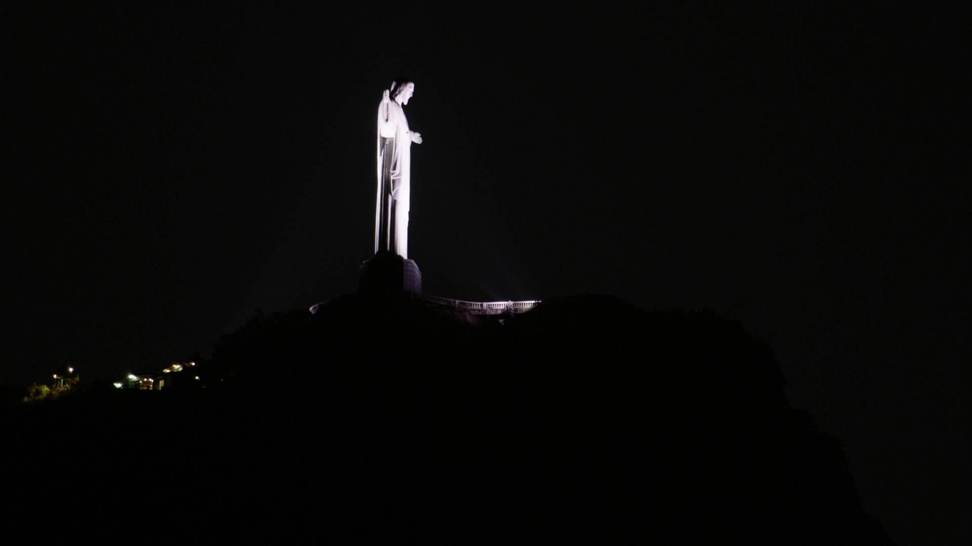 Side View Of Christ the Redeemer Lit Up At Night
