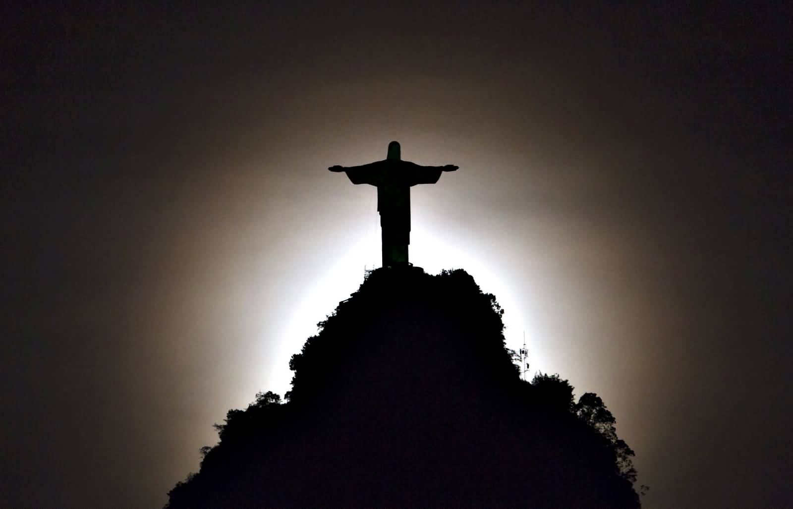 Silhouette View Of Christ the Redeemer At Night