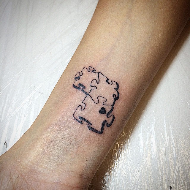 Small Puzzle Pieces Tattoo On Wrist