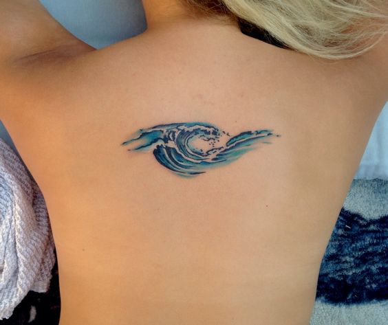 Small Water Wave Tattoo On Girl Upper Back