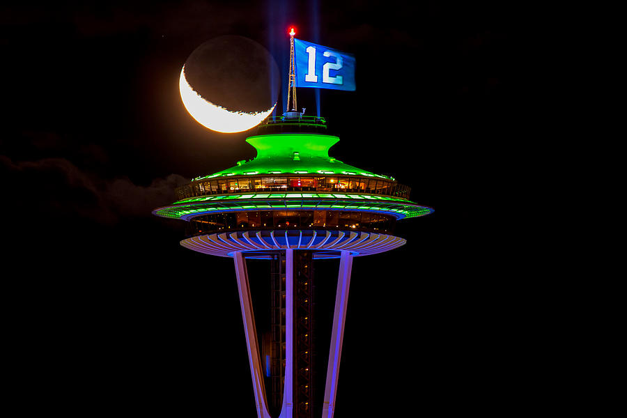 Space Needle Tower With 12th Man Flag With Colorful Lights