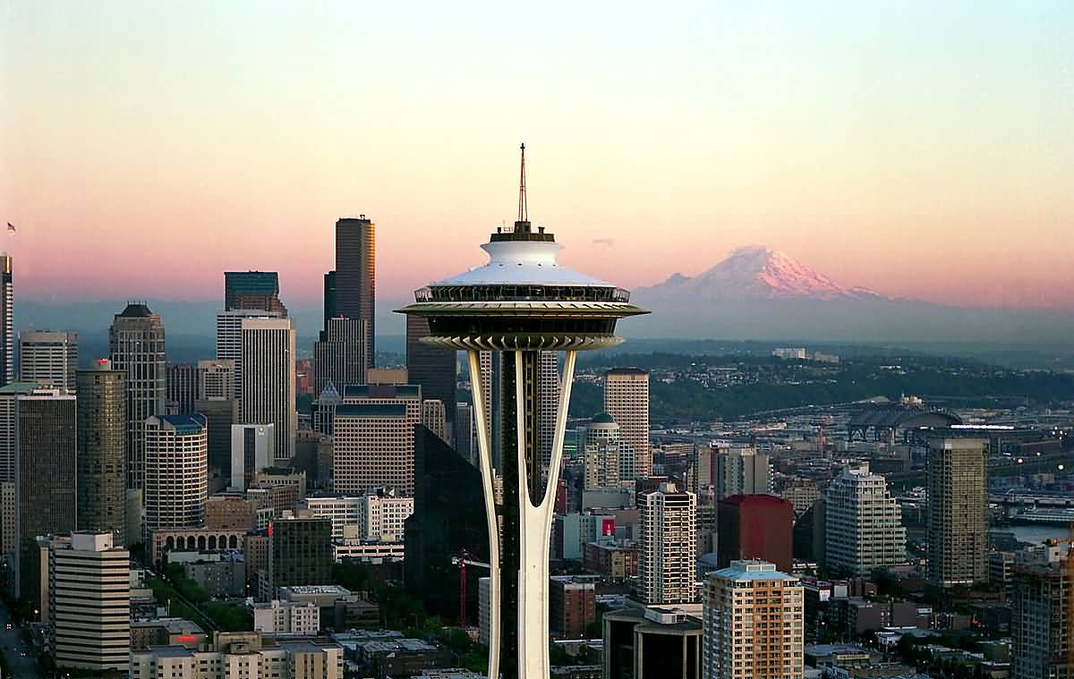 Space Needle With Skyline And Mount Rainier At Sunset