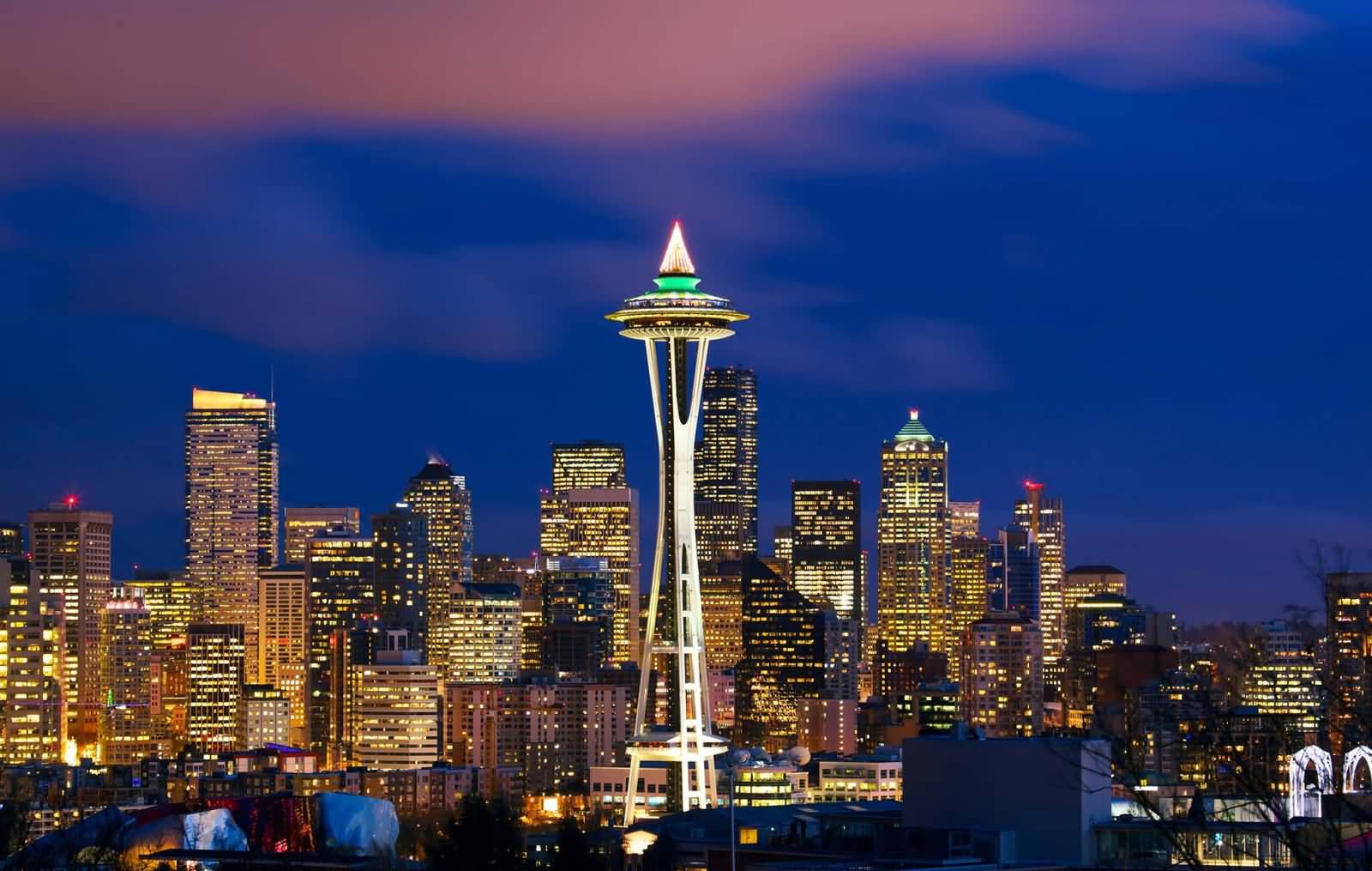 Space Needle With Surrounding Buildings At Night