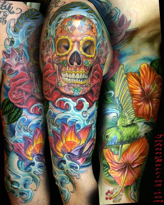 Sugar Skull With Flowers And Water Tattoo On Sleeve