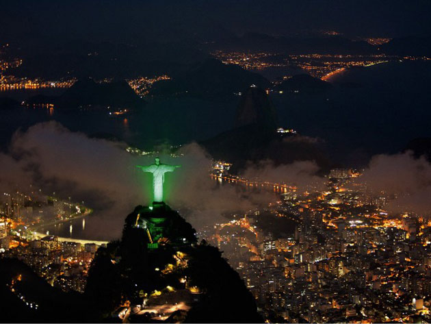 The Brazilian City Of Rio de Janeiro At Night With The Iconic Statue Of Christ the Redeemer