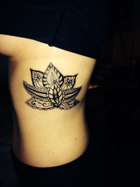 Tribal Lotus Rib Cage Tattoo
