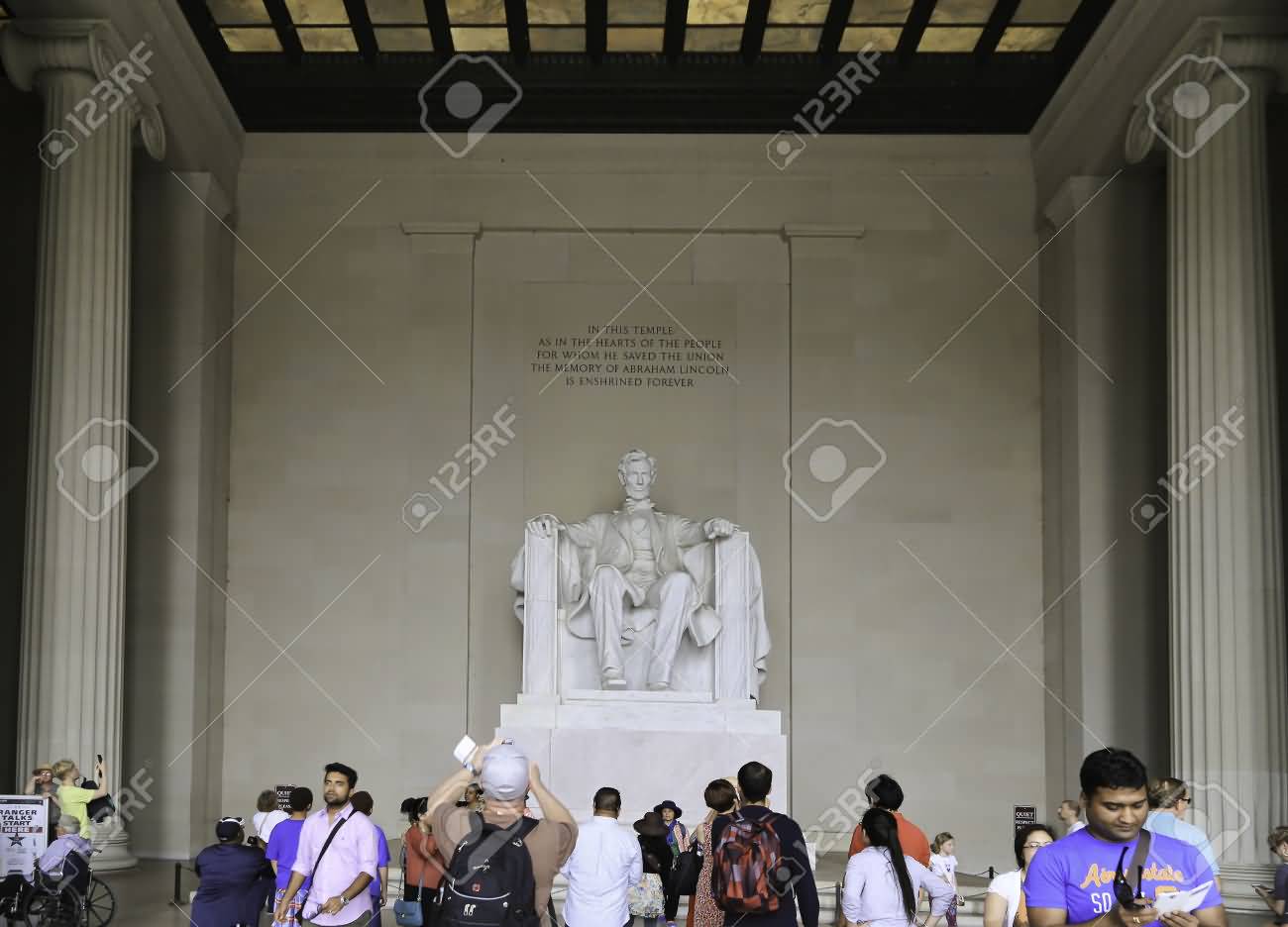 Visitors Inside The Lincoln Memorial To See The Statue Of Abraham Lincoln