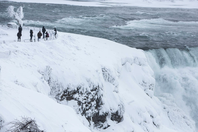 Visitors View Frozen Niagara Falls