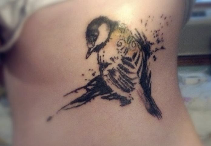 Watercolor Bird Tattoo On Rib Cage