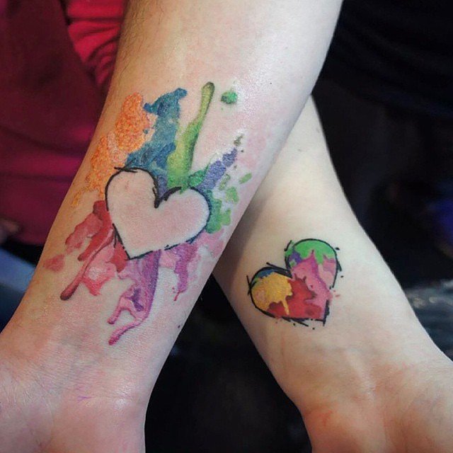 Watercolor Heart Puzzle Tattoos On Wrists