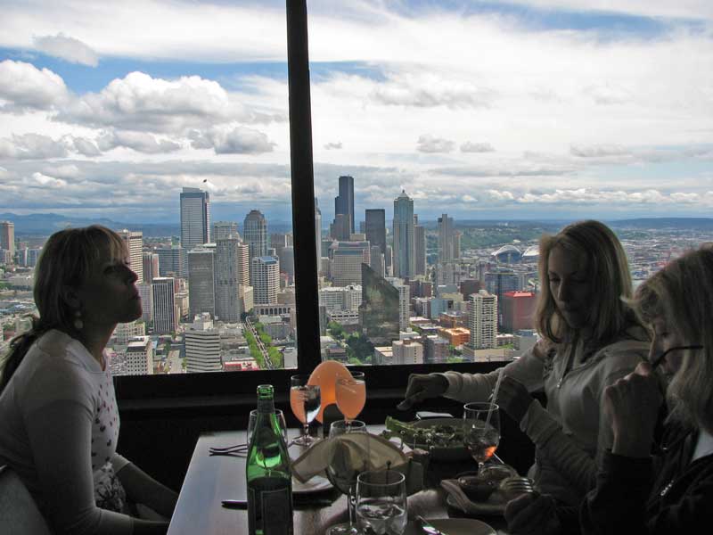 Women Enjoying Food  And Beverages At Restaurant Inside Space Needle Tower