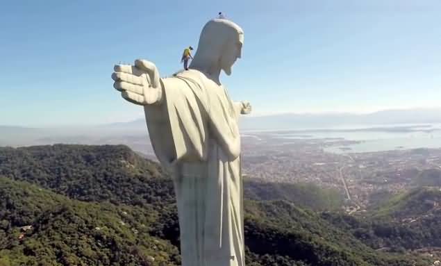 Workers Examine The Christ The Redeemer Statue