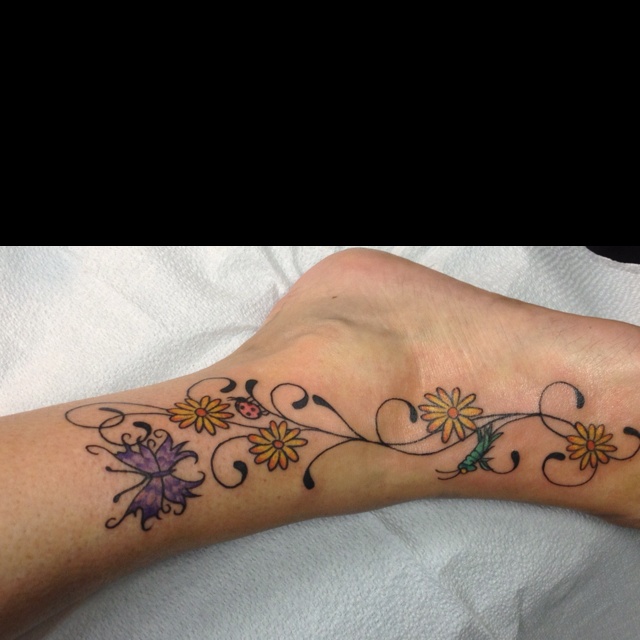 Amazing Butterfly And Daisy Tattoo On Foot