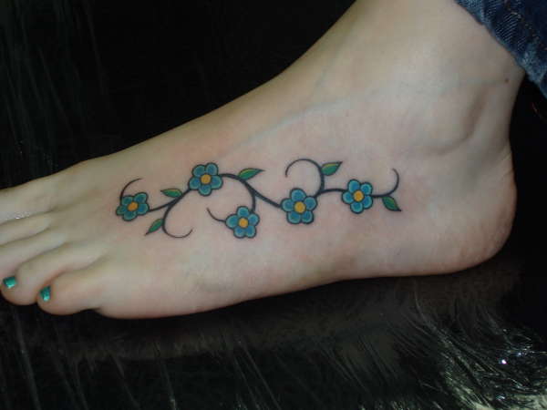 Amazing Daisy Flowers Tattoos On Left Foot