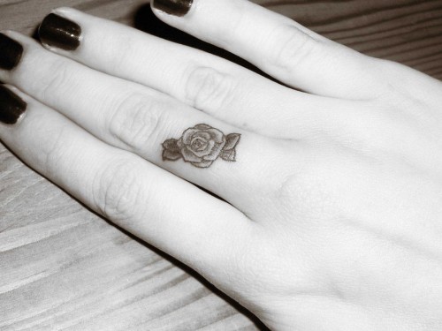 Amazing Flower Tattoo On Middle Finger