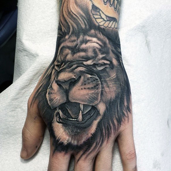 Amazing Lion Hand Tattoo