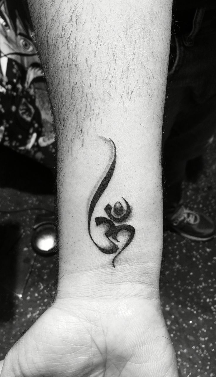 Amazing Om Sign Religious Tattoo On Wrist For Men