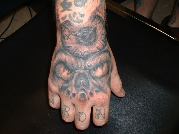 Amazing Scary Clock Tattoo On Man Hand