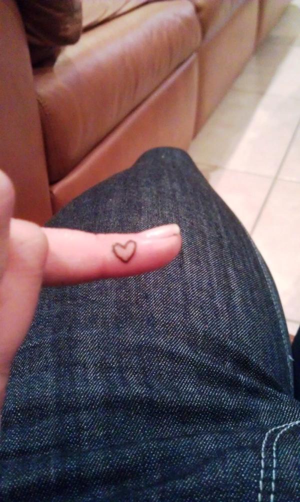 Amazing Small Outline Heart Tattoo On Finger