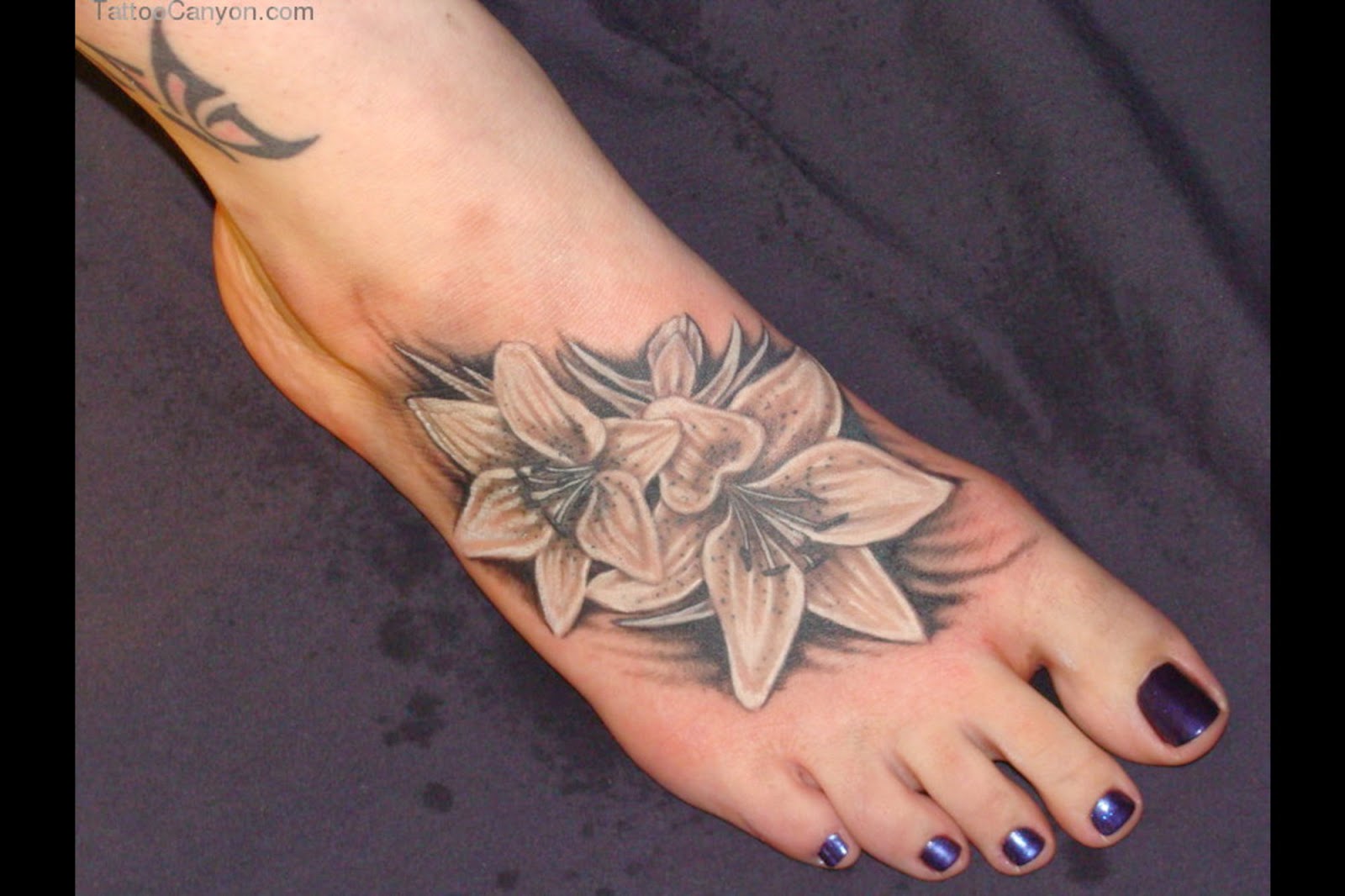 Awesome Black And White Lily Flowers Foot Tattoo