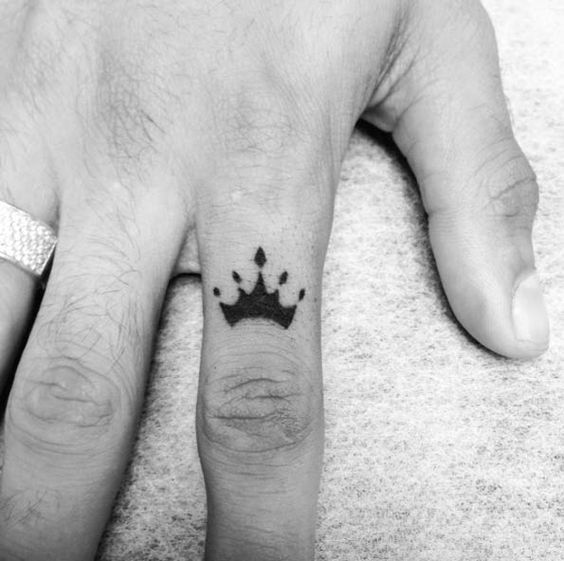 Awesome Black Crown Tattoo On Finger