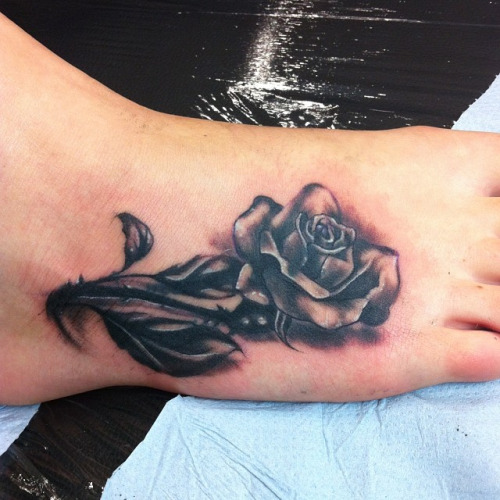 Awesome Black Rose Tattoo On Foot