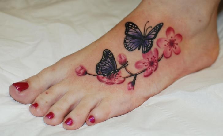 Awesome Cherry Blossom And Butterflies Tattoo On Foot