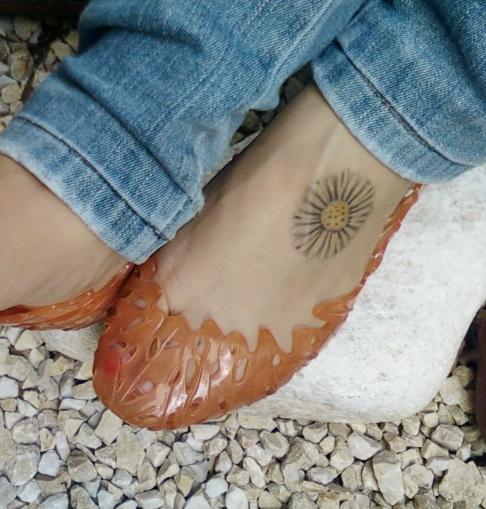 Awesome Daisy Foot Tattoo For Girls