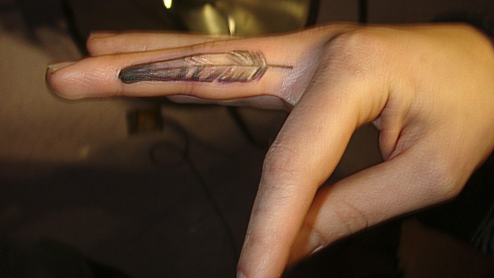 Awesome Feather Tattoo On Side Finger