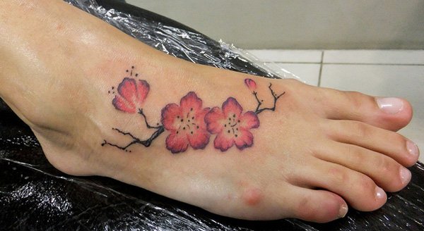 Awesome Pink Cherry Blossom Flowers Tattoo On Foot