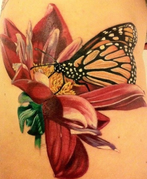 Awesome Realistic Butterfly On Flower Tattoo