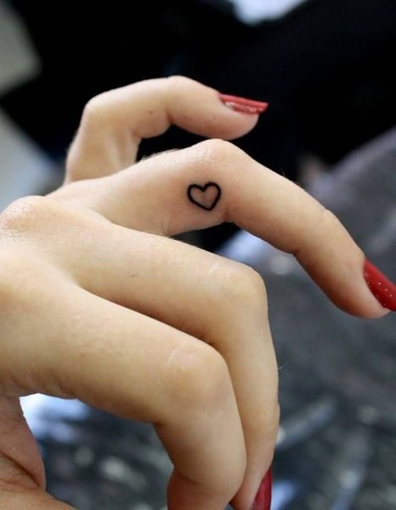 Beautiful Girl With Heart Tattoo On Side Finger