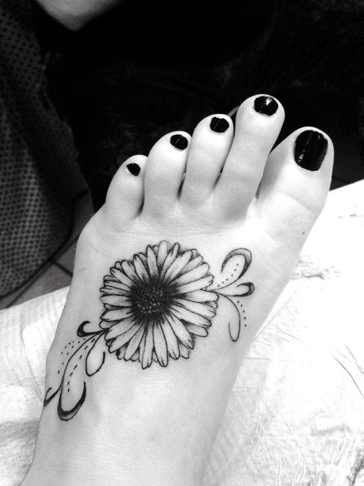 Black And Grey Daisy Flower tattoo On Girl Left Foot